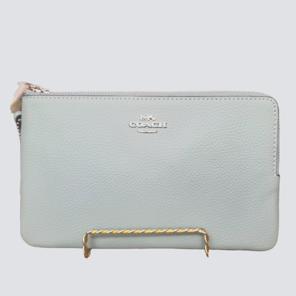 NWT, COACH DOUBLE WRISTLET IN AQUA WITH SILVER HAREWARE 8" W× 5"H× 1"D